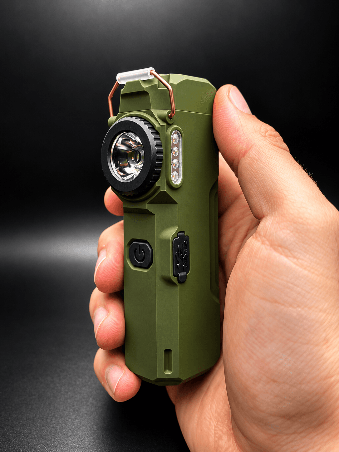 The Arc 80 held in one hand, showing its compact size